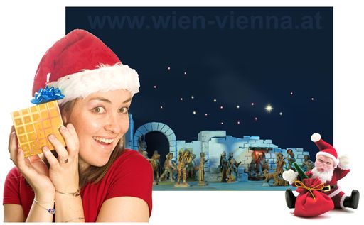  Mitarbeiterin mit Geschenkpäckchen vor Weihnachtskrippe