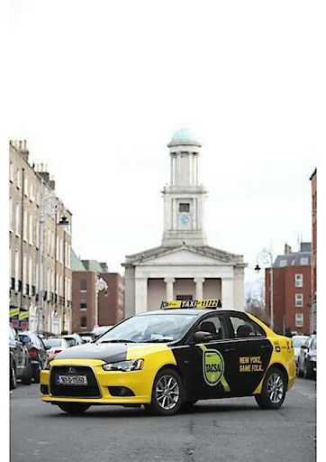  irish mytaxi in front of a church