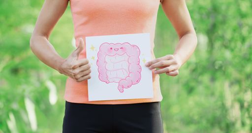 sport woman take intestine board with green
background