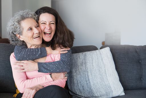  Portrait of happy mid adult woman embracing her
senior mother. Mother and daughter at home, family scene. Family
relationships concept