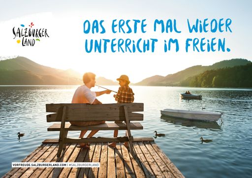 Vorschau Bild von Sujet der SalzburgerLand-Sommerkampagne mit Vater
und Sohn beim Angeln am Fuschlsee: "Das erste Mal wieder
Unterricht im Freien"