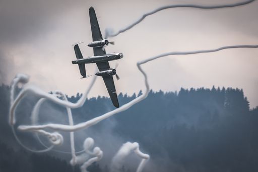 B-25 Mitchell with smokes from T-28 Trojan