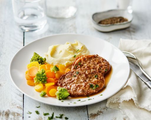 Vorschau Bild von Eine beliebte Speise aus dem Sortiment von GOURMET
Daheim: Faschierte Kalbsbutterschnitzel mit Kartoffelpüree und
buntem Gemüse.