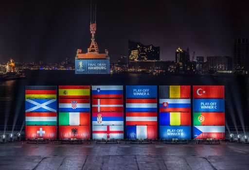 Port workers in Hamburg stack containers with flags of the EURO
2024 teams in accordance with the Final Draw / Die Verwendung dieses
Bildes für redaktionelle Zwecke ist unter Beachtung aller
mitgeteilten Nutzungsbedingungen zulässig und dann auch honorarfrei.
Veröffentlichung ausschließlich mit Bildrechte-Hinweis.