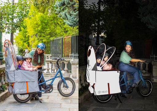  VELLO SUB E-Cargo Bike mit reflektierenden Cocoon für den
wettergeschützten Transport von bis zu zwei Kindern. Das SUB Cocoon
ist das perfekte Zubehör für alle SUB-fahrer*innen, die ihre Kinder
unabhängig vom Wetter trocken und sicher transportieren wollen.